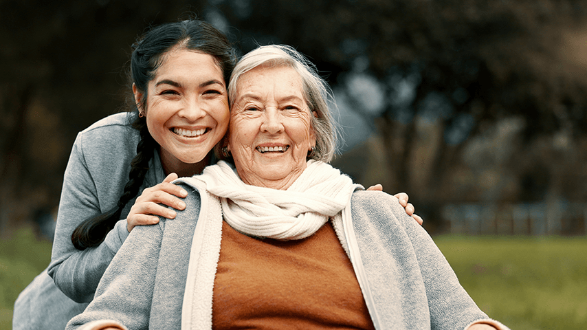 smiling grandmother and granddaughter