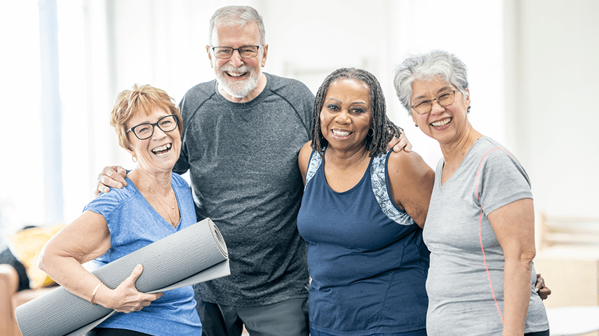 three older women and an older man after exercise class