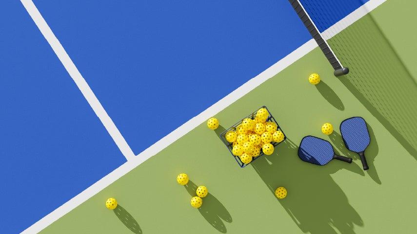 Pickleball court, paddles, and balls. Read these tips that can help all pickleball players, including older adults, stay injury-free.