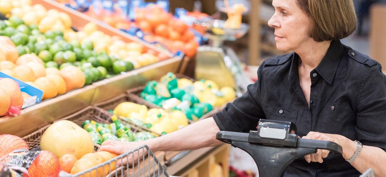 An elderly caucasian woman is sitting in a motorized wheelchair picking out produce at the grocery store. If you're wondering if you qualify for SNAP while on disability, the answer is yes. It’s possible to qualify for and receive SNAP benefits while you also collect Social Security Disability Insurance (SSDI) and/or Supplemental Security Income (SSI) payments.