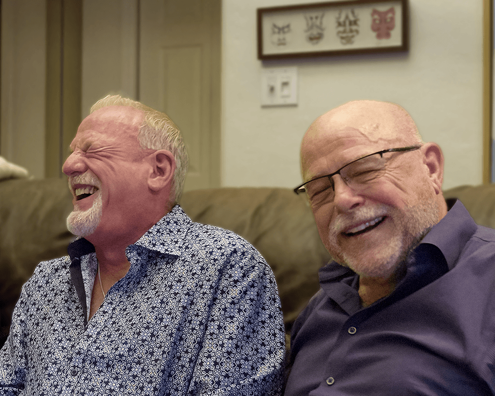 two older men laughing