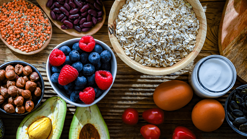 A display of healthy foods like oats, eggs, and berries